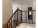 Upstairs hallway with wood railing and carpet at 2118 Water Mill Ct, Buford, GA 30519