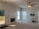 Living room with fireplace, neutral walls, and backyard access at 2118 Water Mill Ct, Buford, GA 30519