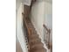 Elegant staircase with wood railing and carpet at 2118 Water Mill Ct, Buford, GA 30519