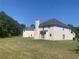 Expansive backyard with a view of the house and surrounding trees at 2118 Water Mill Ct, Buford, GA 30519