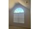 Bright bedroom with large arched window and neutral carpeting at 2118 Water Mill Ct, Buford, GA 30519
