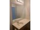 Bathroom vanity with sink, mirror, and light fixture at 2118 Water Mill Ct, Buford, GA 30519