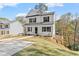 Two-story home with white siding and black windows at 6385 Akins Way, Cumming, GA 30041