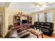 Living room with dark brown leather furniture at 1142 Pontiac Cir, Austell, GA 30168