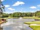 Picturesque golf course with a pond and fountain at 424 Lake Point Trce, Canton, GA 30114