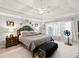 Large main bedroom with a king-size bed, window seating and ceiling fan at 424 Lake Point Trce, Canton, GA 30114