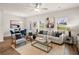 Spacious living room with neutral colored couch and large windows at 224 Epping St # 7, Stockbridge, GA 30281