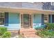 Inviting front entrance with brick walkway and blue siding at 2548 Mercedes Ne Dr, Atlanta, GA 30345