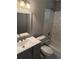 Bathroom with grey vanity, white toilet, and marble tile at 3665 Chestnut Dr # B4, Atlanta, GA 30340