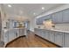 Spacious kitchen with gray cabinets, quartz countertops, and stainless steel appliances at 1772 Brittany Chase Nw, Kennesaw, GA 30152