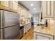 Galley kitchen with stainless steel appliances, granite countertops, and ample cabinetry at 653 N Highland Ne Ave # 1, Atlanta, GA 30306