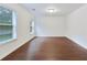 Unfinished basement featuring hardwood floors and large windows at 3690 Dalwood Dr, Suwanee, GA 30024