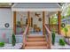 Inviting front porch with rocking chair and decorative accents at 1485 Ryan Sw St, Atlanta, GA 30310