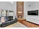 Living room with a stone fireplace and hardwood floors at 313 Hill Top Overlook, Canton, GA 30114