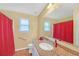 Clean bathroom with granite countertop and red shower curtain at 313 Hill Top Overlook, Canton, GA 30114