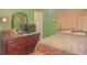 Spacious bedroom with a large bed and dresser at 2530 N Bryan Cir, Atlanta, GA 30344