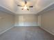 Spacious bedroom with ceiling fan and plush carpeting at 340 Bay Grove Rd, Loganville, GA 30052