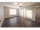 Spacious bedroom with wood-look floors and private bathroom access at 340 Bay Grove Rd, Loganville, GA 30052