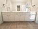 Clean bathroom with double vanity and neutral tones at 340 Bay Grove Rd, Loganville, GA 30052