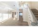 Two-story foyer with staircase and views to living room and dining room at 340 Bay Grove Rd, Loganville, GA 30052