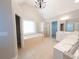 Elegant bathroom with soaking tub, shower, and double vanity at 340 Bay Grove Rd, Loganville, GA 30052
