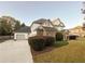 Two-story house with attached garage and manicured landscaping at 340 Bay Grove Rd, Loganville, GA 30052