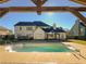Inviting in-ground pool with pergola and spacious backyard at 340 Bay Grove Rd, Loganville, GA 30052