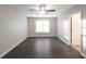 Bright bedroom featuring wood-look floors and large window at 340 Bay Grove Rd, Loganville, GA 30052