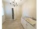 Laundry room with granite countertop and built-in cabinets at 340 Bay Grove Rd, Loganville, GA 30052