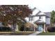 Two-story house with brick and siding, featuring a light blue door and landscaped yard at 340 Bay Grove Rd, Loganville, GA 30052