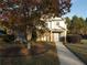 Two-story house with brick and siding, featuring a light blue door and landscaping at 340 Bay Grove Rd, Loganville, GA 30052