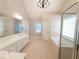 Primary bathroom with double vanity, soaking tub, and separate shower at 340 Bay Grove Rd, Loganville, GA 30052