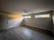 Spacious bedroom with hardwood floors and large windows at 340 Bay Grove Rd, Loganville, GA 30052