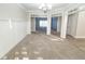 Formal dining room with carpeted floor, chandelier, and built-in shelving at 340 Bay Grove Rd, Loganville, GA 30052