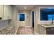 Kitchen features white cabinets, granite countertops and laundry area at 340 Bay Grove Rd, Loganville, GA 30052