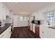 Modern kitchen with white cabinets and dark countertops at 1778 Campbellton Sw Rd, Atlanta, GA 30311