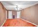 Large bedroom with orange carpet and striped wallpaper at 1778 Campbellton Sw Rd, Atlanta, GA 30311