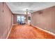 Spacious living room with orange carpet and striped wallpaper at 1778 Campbellton Sw Rd, Atlanta, GA 30311