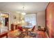 Dining room with glass table and view into kitchen at 1778 Campbellton Sw Rd, Atlanta, GA 30311