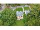 Aerial view of a charming house with a spacious backyard and surrounding trees at 1778 Campbellton Sw Rd, Atlanta, GA 30311
