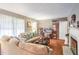 Living room with hardwood floors, sectional sofa, and fireplace at 1778 Campbellton Sw Rd, Atlanta, GA 30311