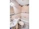 Bathroom with peeling wallpaper and worn fixtures at 1778 Campbellton Sw Rd, Atlanta, GA 30311