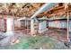 Unfinished basement with exposed utilities and dirt floor at 1778 Campbellton Sw Rd, Atlanta, GA 30311