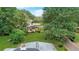 Elevated view of the backyard showcasing a large green lawn and mature trees at 1778 Campbellton Sw Rd, Atlanta, GA 30311