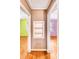 Small hallway with built-in shelving and hardwood floors at 1778 Campbellton Sw Rd, Atlanta, GA 30311
