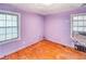 Lavender bedroom with hardwood floors and window coverings at 1778 Campbellton Sw Rd, Atlanta, GA 30311