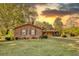 Brick ranch house with a yard and driveway at 1594 Harbour Oaks Rd, Tucker, GA 30084