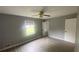Gray-walled bedroom with gray vinyl flooring and ceiling fan at 2073 Marbut Ln, Lithonia, GA 30058