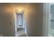 Clean hallway with grey walls and wood-look flooring at 2073 Marbut Ln, Lithonia, GA 30058