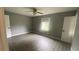 Bright bedroom with grey walls and wood-look flooring at 2073 Marbut Ln, Lithonia, GA 30058